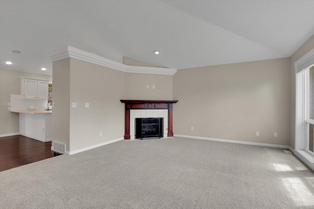 2019 S Saint Charles Rd, Veradale, WA 99037 - unfurnished living room with lofted ceiling, carpet flooring, recessed lighting, and a tiled fireplace