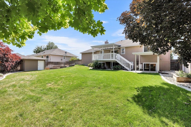 2019 S Saint Charles Rd, Veradale, WA 99037 - fenced backyard featuring a storage shed, stairway, and a deck