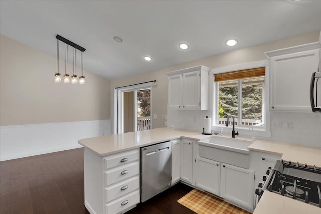 2019 S Saint Charles Rd, Veradale, WA 99037 - kitchen with stainless steel dishwasher, a peninsula, backsplash, dark wood-style flooring, and recessed lighting