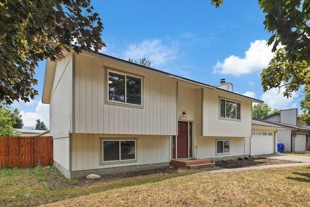 1707 S Early Dawn Dr, Spokane Valley, WA 99037 - bi-level home with a garage and a chimney