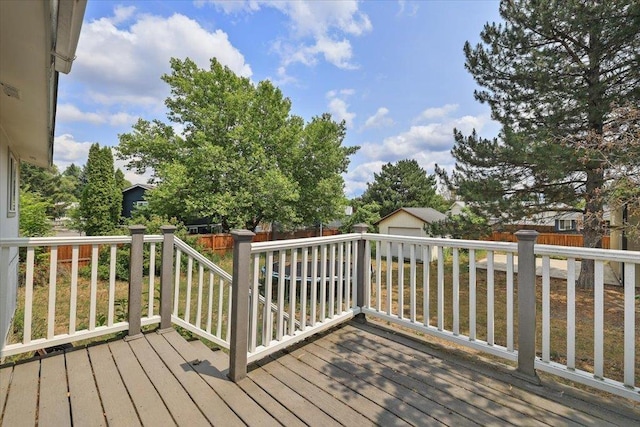 1707 S Early Dawn Dr, Spokane Valley, WA 99037 - wooden deck featuring an outdoor structure and a fenced backyard