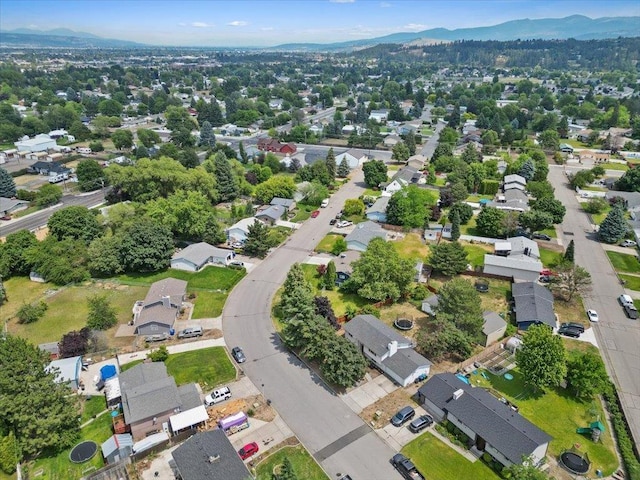 1707 S Early Dawn Dr, Spokane Valley, WA 99037 - aerial view of property's location featuring a mountain backdrop and nearby suburban area