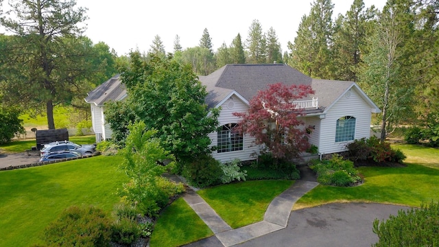 16303 S Cheney-Spokane Rd, Cheney, WA 99004 - obstructed view of property with a front lawn and a balcony
