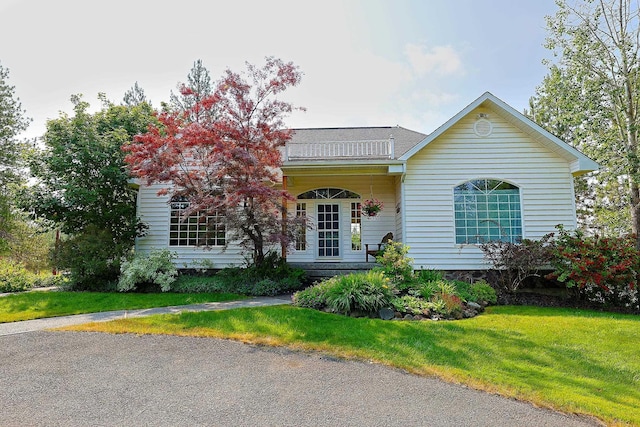 16303 S Cheney-Spokane Rd, Cheney, WA 99004 - traditional-style house featuring a front yard and a balcony
