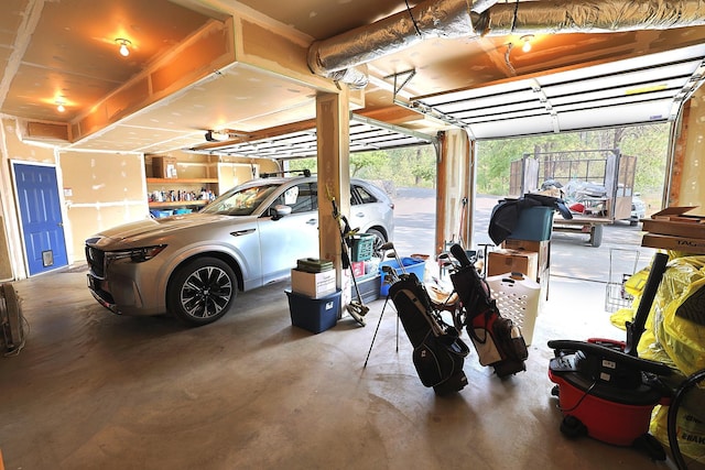 16303 S Cheney-Spokane Rd, Cheney, WA 99004 - garage featuring a garage door opener