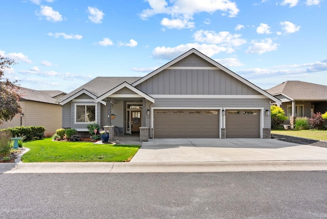 8814 E Clearview Ln, Spokane, WA 99217 - craftsman inspired home with an attached garage, board and batten siding, a front yard, concrete driveway, and stone siding