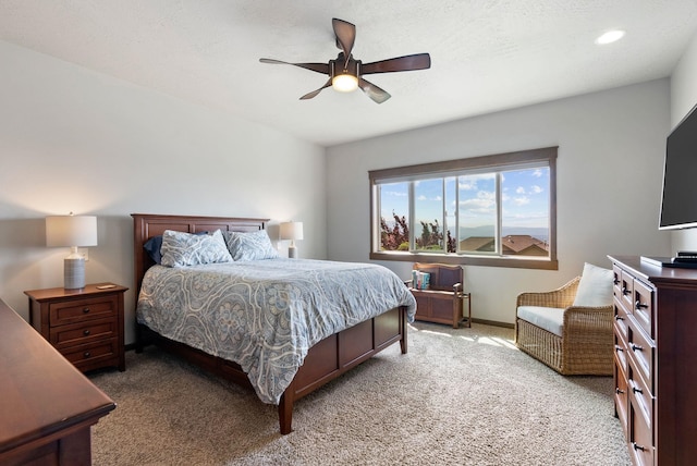 8814 E Clearview Ln, Spokane, WA 99217 - bedroom with light colored carpet, a ceiling fan, and recessed lighting