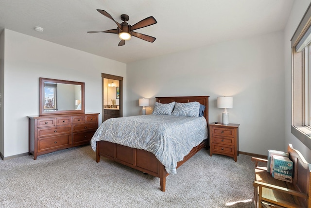 8814 E Clearview Ln, Spokane, WA 99217 - bedroom with light colored carpet, ensuite bathroom, and a ceiling fan