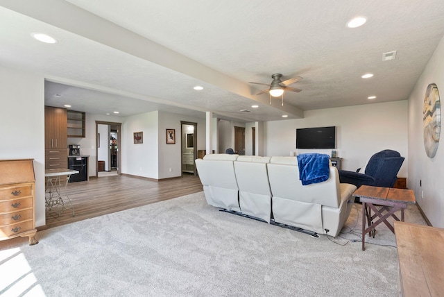 8814 E Clearview Ln, Spokane, WA 99217 - carpeted living area featuring recessed lighting, a ceiling fan, and wood finished floors