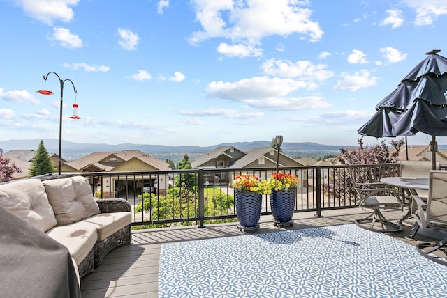 8814 E Clearview Ln, Spokane, WA 99217 - wooden terrace featuring a mountain view and an outdoor living space