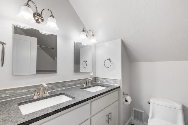 4171 S Westway Dr, Coeur D Alene, ID 83814 - full bathroom featuring double vanity and lofted ceiling