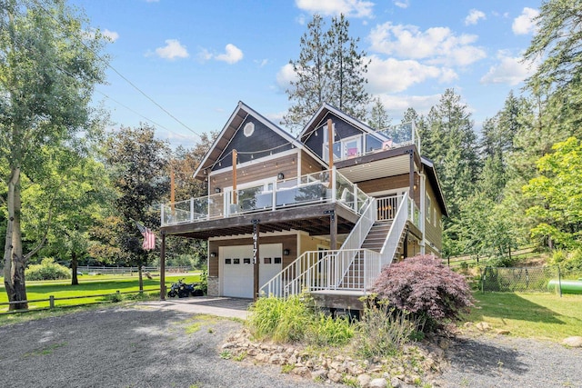 4171 S Westway Dr, Coeur D Alene, ID 83814 - chalet / cabin featuring an attached garage, a wooden deck, stairs, and asphalt driveway