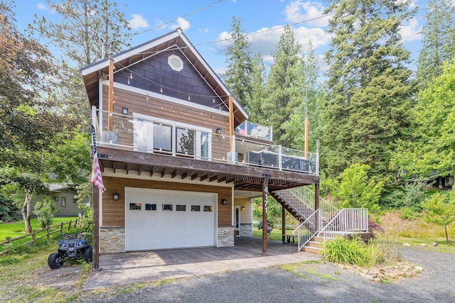 4171 S Westway Dr, Coeur D Alene, ID 83814 - view of front of property featuring an attached garage, stone siding, driveway, and stairs