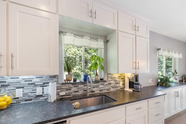 4171 S Westway Dr, Coeur D Alene, ID 83814 - kitchen with tasteful backsplash, white cabinets, and dark stone counters
