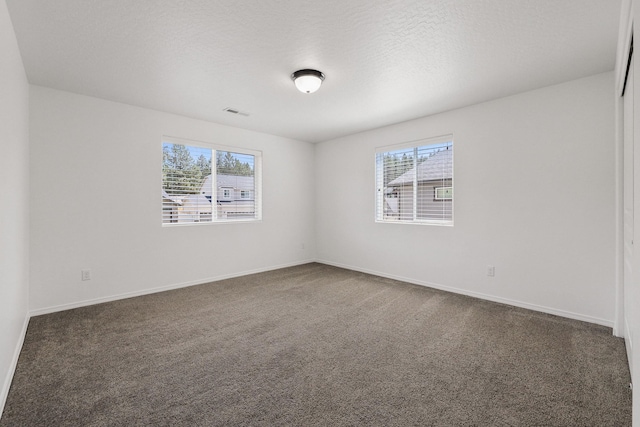 4813 S Lapwai Ln, Spokane, WA 99206 - spare room with healthy amount of natural light and dark carpet