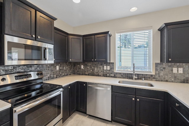 4813 S Lapwai Ln, Spokane, WA 99206 - kitchen with stainless steel appliances, light countertops, backsplash, light tile patterned floors, and recessed lighting