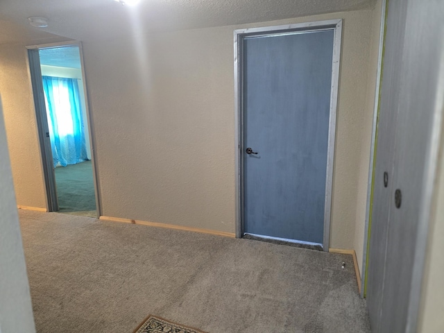 1528 E Boone Ave, Spokane, WA 99202 - carpeted empty room featuring a textured wall and a smoke detector