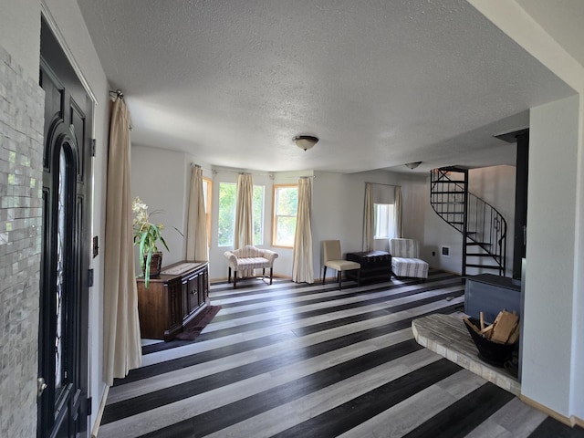 1528 E Boone Ave, Spokane, WA 99202 - entryway featuring a textured ceiling, stairs, and wood finished floors