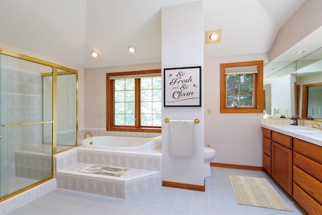 10207 N Comanche Dr, Spokane, WA 99208 - full bathroom featuring vanity, vaulted ceiling, a garden tub, a shower stall, and tile patterned floors