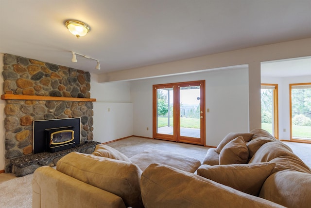 10207 N Comanche Dr, Spokane, WA 99208 - living area featuring light carpet, plenty of natural light, and rail lighting