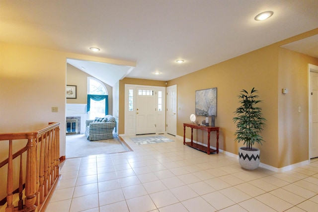 10207 N Comanche Dr, Spokane, WA 99208 - foyer entrance featuring recessed lighting, a glass covered fireplace, and lofted ceiling