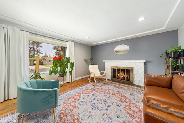 224 W Hoerner Ave, Spokane, WA 99218 - living room with a stone fireplace, wood finished floors, and recessed lighting