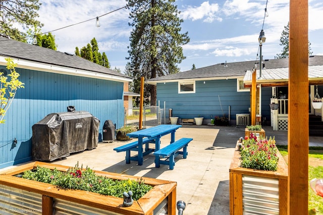 224 W Hoerner Ave, Spokane, WA 99218 - view of patio featuring a grill and a wooden deck