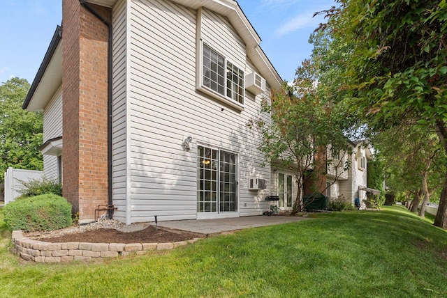 7878 N Wilding Dr # 32, Spokane, WA 99208 - back of house with a yard, a patio, brick siding, and french doors