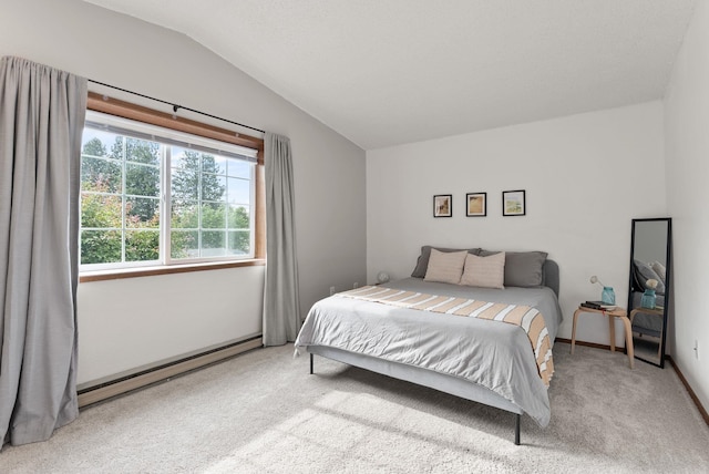 7878 N Wilding Dr # 32, Spokane, WA 99208 - bedroom featuring a baseboard heating unit, lofted ceiling, and carpet floors