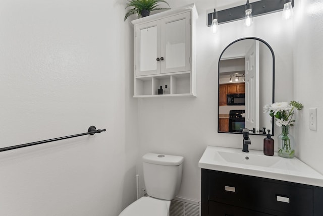 7878 N Wilding Dr # 32, Spokane, WA 99208 - bathroom featuring toilet and vanity