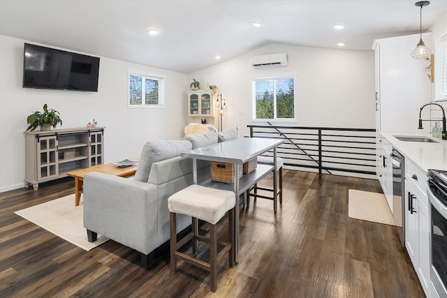 3 W Montgomery Rd, Deer Park, WA 99006 - living room with a wall mounted air conditioner, lofted ceiling, dark wood-type flooring, and recessed lighting