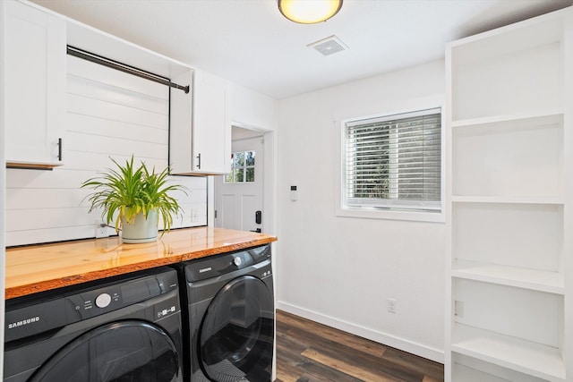 3 W Montgomery Rd, Deer Park, WA 99006 - washroom with washer and dryer, dark wood-type flooring, and cabinet space
