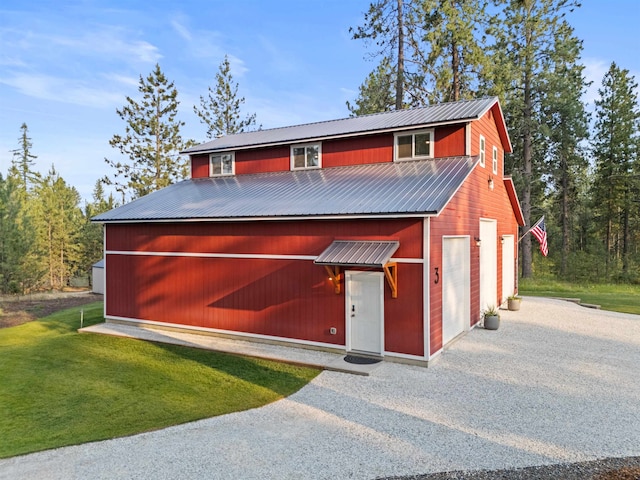 3 W Montgomery Rd, Deer Park, WA 99006 - view of front of property featuring a front yard, a metal roof, driveway, and a garage