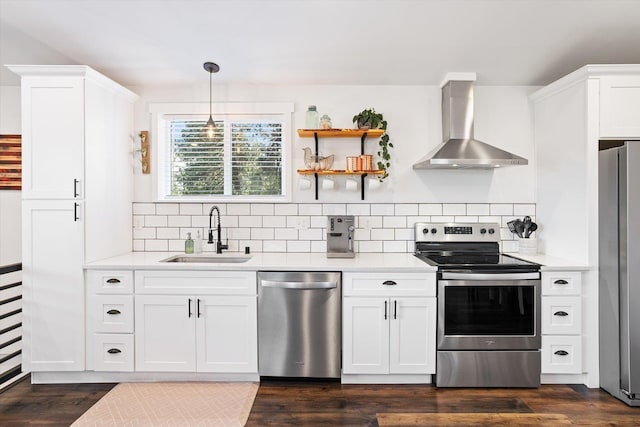 3 W Montgomery Rd, Deer Park, WA 99006 - kitchen with stainless steel appliances, wall chimney exhaust hood, light countertops, and white cabinetry