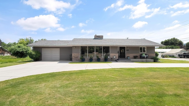 709 W Clay Ave, Chewelah, WA 99109 - ranch-style home featuring driveway, a front lawn, an attached garage, and a chimney