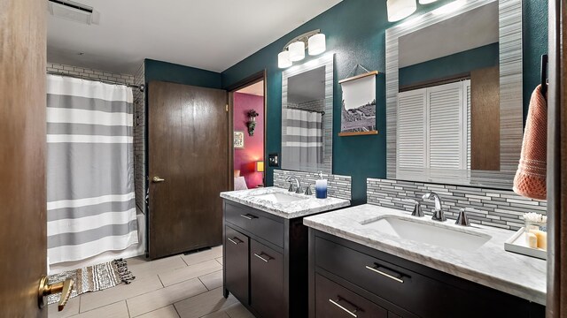 709 W Clay Ave, Chewelah, WA 99109 - bathroom with backsplash, two vanities, tile patterned floors, and a shower with curtain