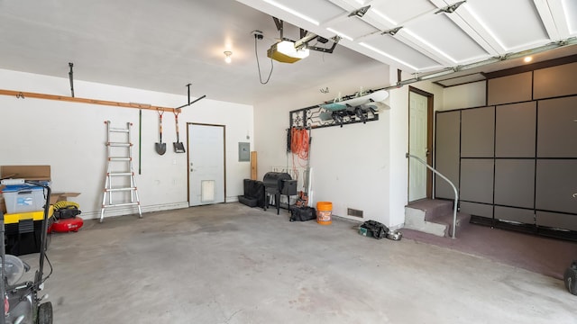 709 W Clay Ave, Chewelah, WA 99109 - garage with electric panel and a garage door opener