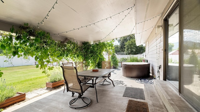 709 W Clay Ave, Chewelah, WA 99109 - fenced backyard featuring a patio, a hot tub, and outdoor dining area