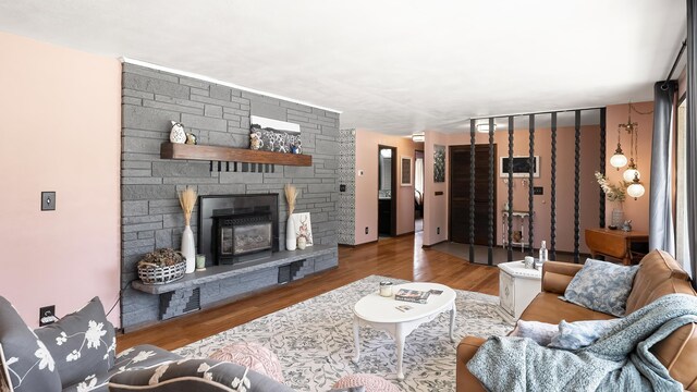709 W Clay Ave, Chewelah, WA 99109 - living room with a stone fireplace and wood finished floors