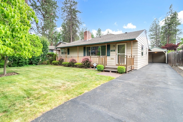 4112 S Hogan St, Spokane, WA 99203 - ranch-style house featuring a carport, a porch, a chimney, and asphalt driveway