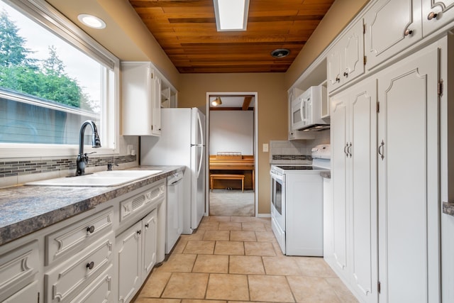 4112 S Hogan St, Spokane, WA 99203 - kitchen featuring white appliances, wooden ceiling, white cabinetry, backsplash, and light tile patterned floors