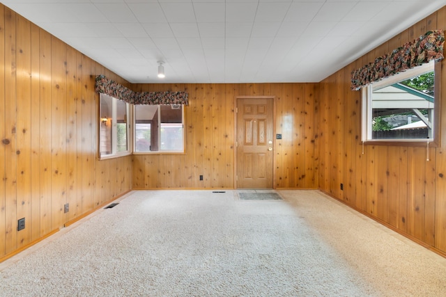 4112 S Hogan St, Spokane, WA 99203 - unfurnished room with healthy amount of natural light, wood walls, and carpet