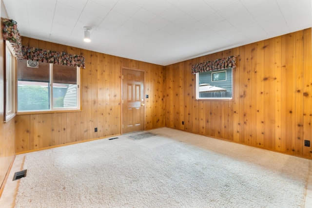4112 S Hogan St, Spokane, WA 99203 - empty room featuring carpet and wood walls