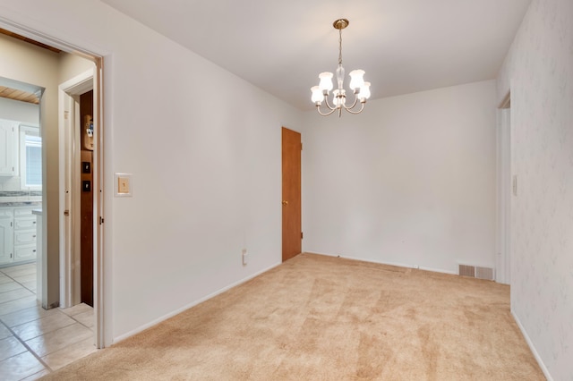 4112 S Hogan St, Spokane, WA 99203 - empty room featuring a chandelier and light colored carpet