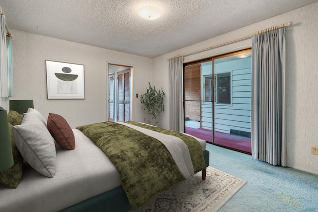 4112 S Hogan St, Spokane, WA 99203 - bedroom featuring carpet floors, access to outside, a textured ceiling, and a closet