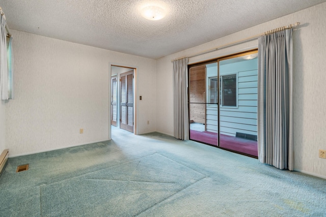 4112 S Hogan St, Spokane, WA 99203 - spare room featuring carpet and a textured ceiling