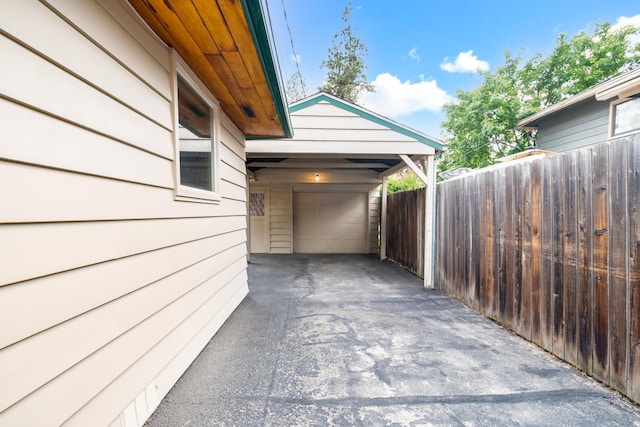 4112 S Hogan St, Spokane, WA 99203 - view of patio / terrace with a garage and asphalt driveway