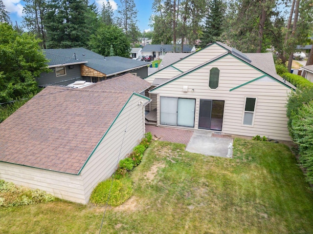 4112 S Hogan St, Spokane, WA 99203 - back of house featuring a patio and a yard