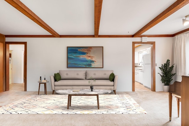 4112 S Hogan St, Spokane, WA 99203 - living room featuring beamed ceiling and light carpet