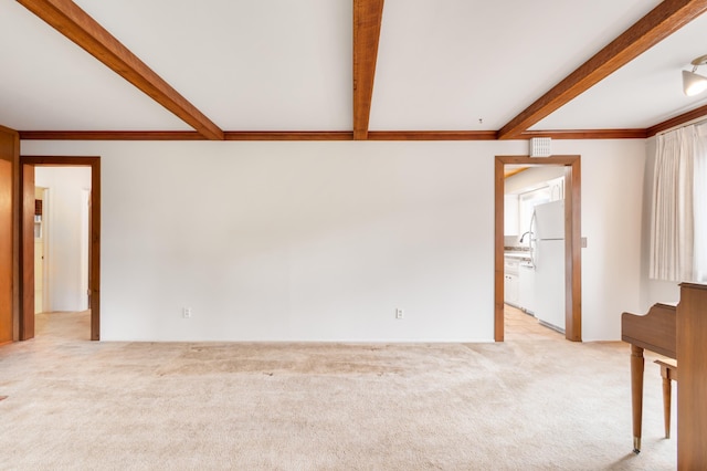 4112 S Hogan St, Spokane, WA 99203 - empty room with beam ceiling and light colored carpet